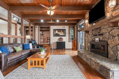 Inviting lake house living area with plenty of seating and natural light throughout.