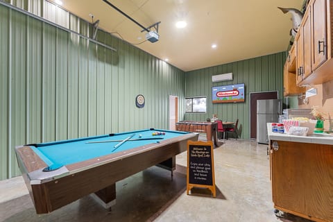 Dedicated game room with pool table adds nonstop entertainment for families and groups.