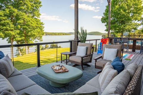 Stretch out in the outdoor living space with cozy seating and beautiful lake views in every direction.