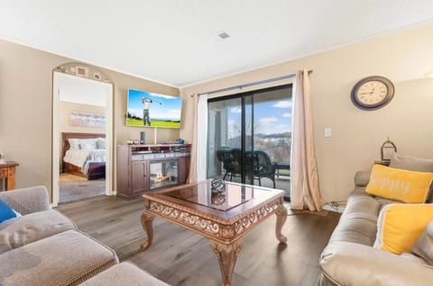 Open living room with comfortable seating and smart TV.