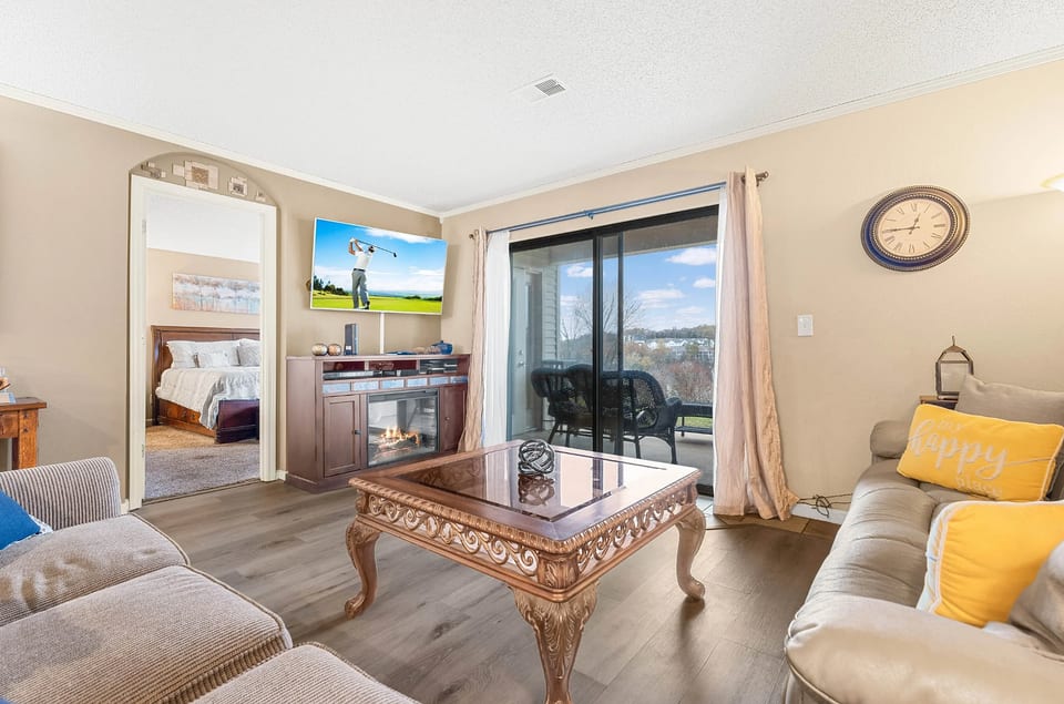 Open living room with comfortable seating and smart TV.