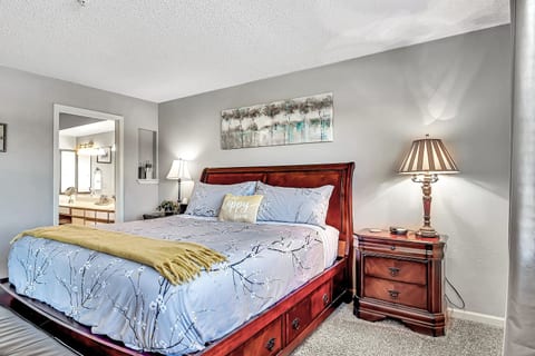 Comfortable king bedroom with plush bedding and soft lighting for a restful stay.
