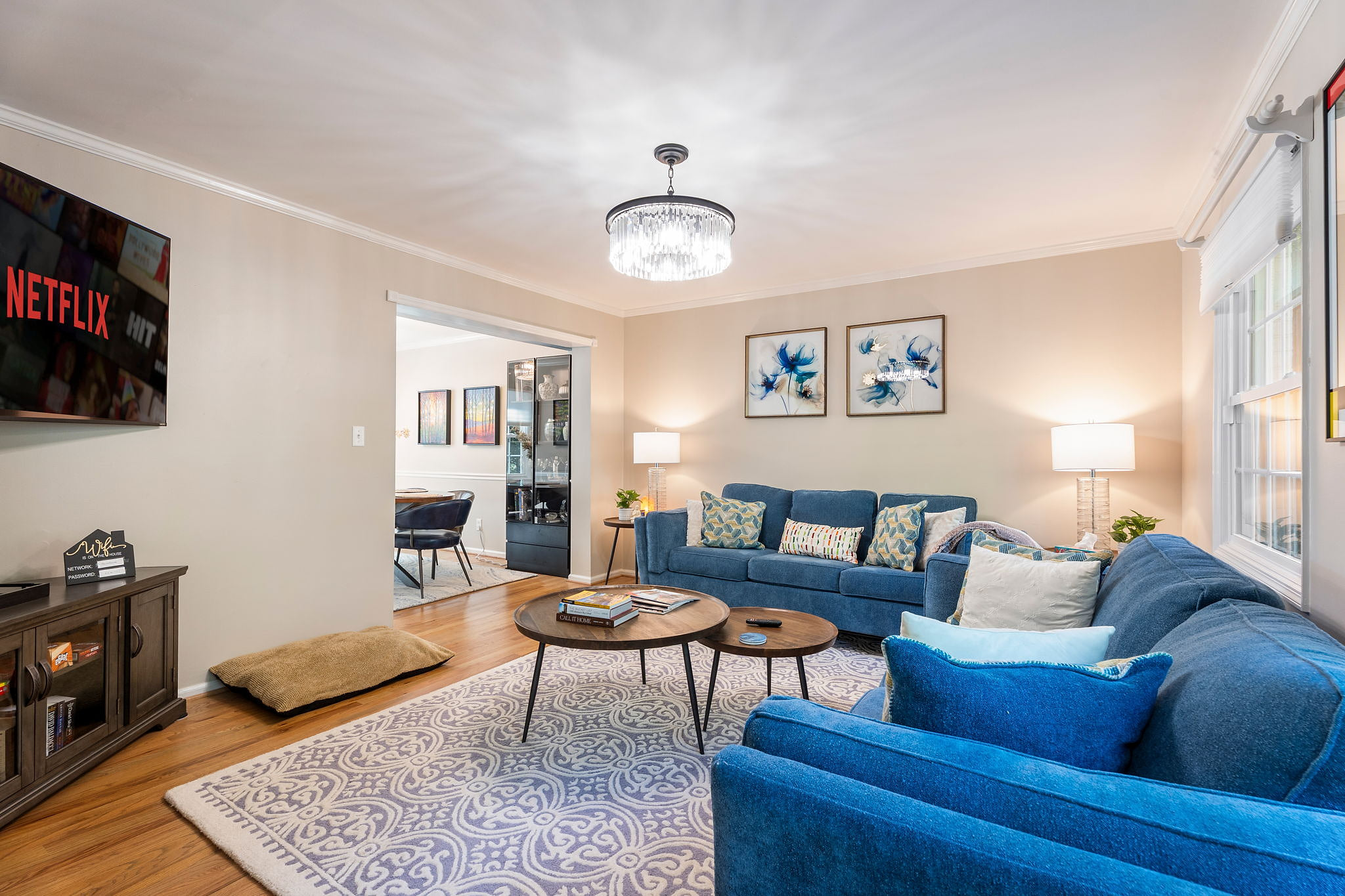 Bright living room with plush seating, smart TV, and elegant modern decor