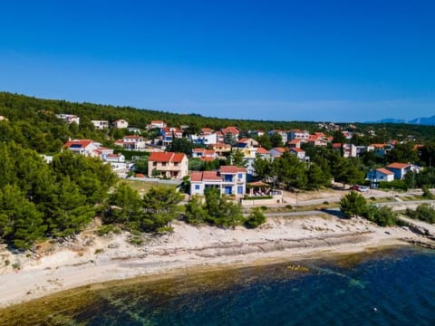 Beachfront villa Noa with heated pool