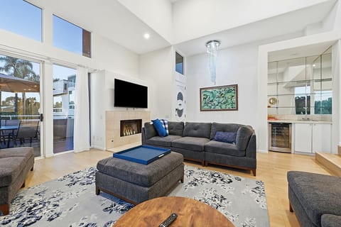 Living and Dining Room with High Ceilings and Wet Bar