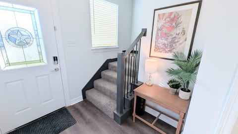 Drop off the keys, hang your jacket on the coat hook, and head upstairs to the bedrooms.