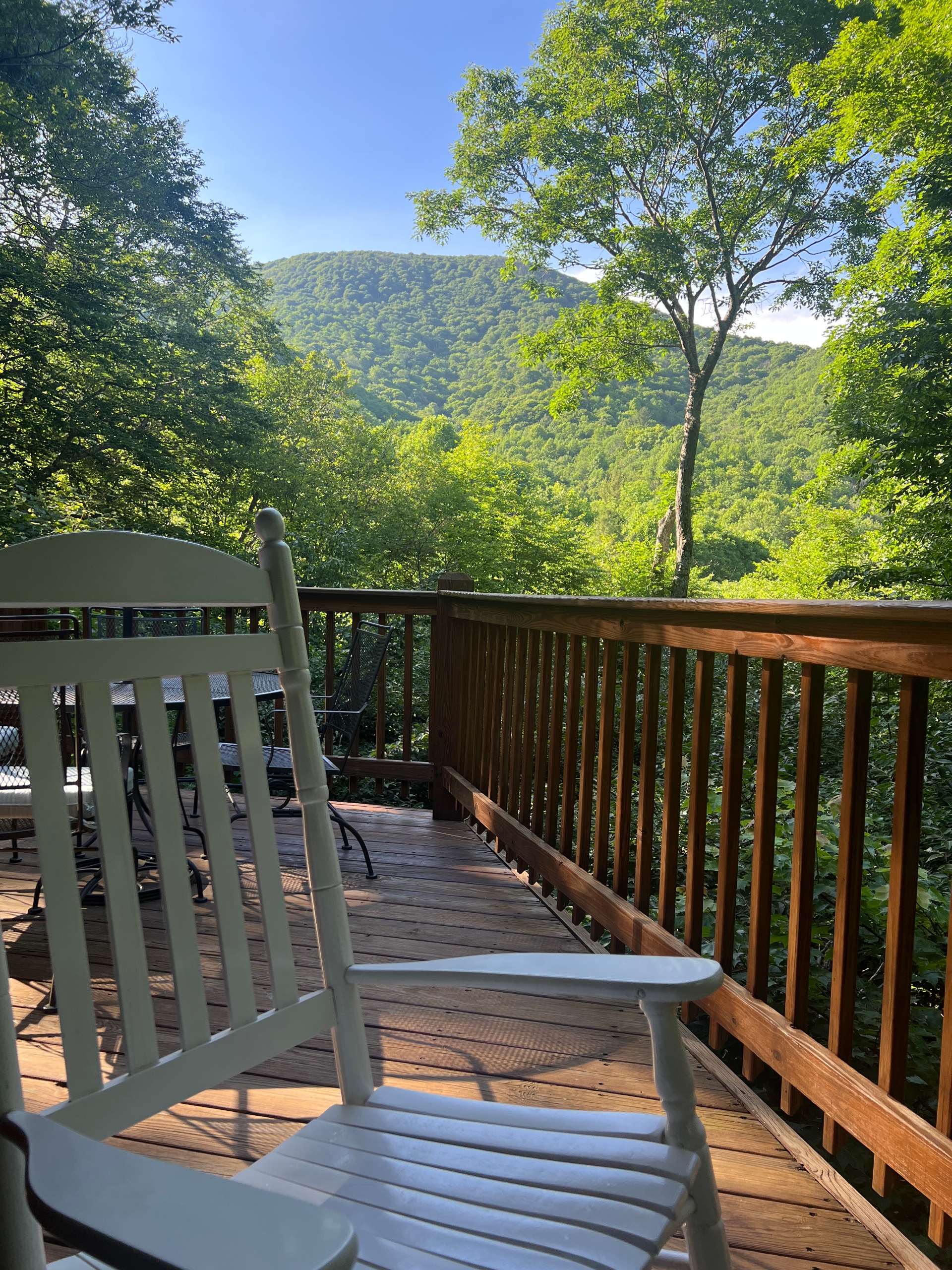 Consider bringing the white rockers from inside out on the covered porch for a relaxing afternoon.