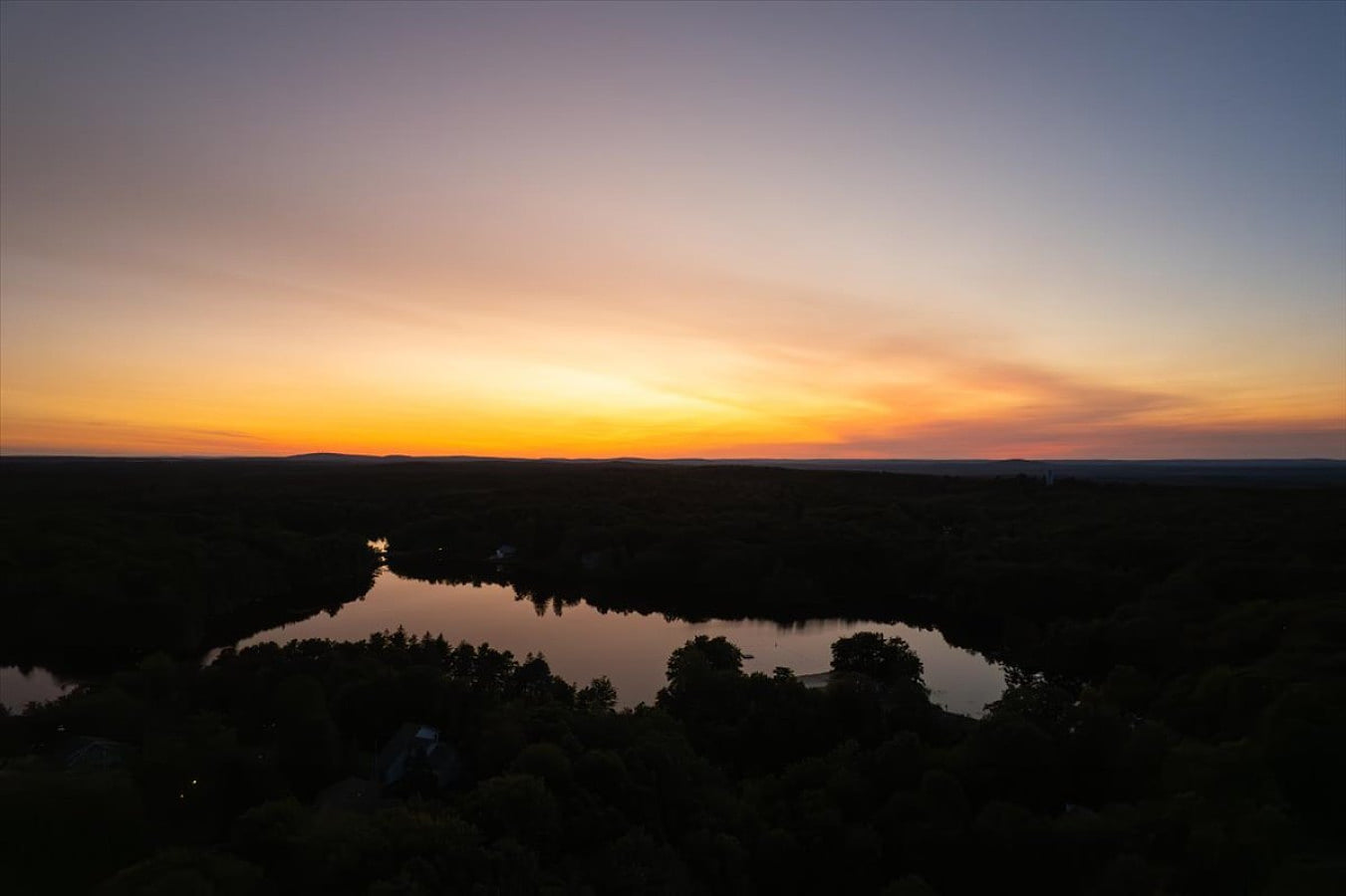 Aerial lake view highlighting the surrounding natural landscape
