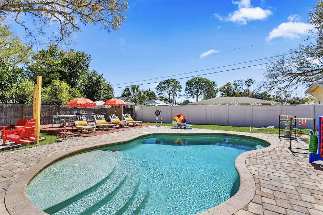Relax poolside with sun loungers and an umbrella for the perfect balance of sun and shade.
