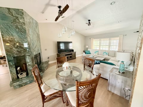 Living room with pull out couch, flatscreen and dining table
