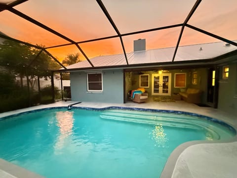 Sunrise over the pool and covered outdoor seating.