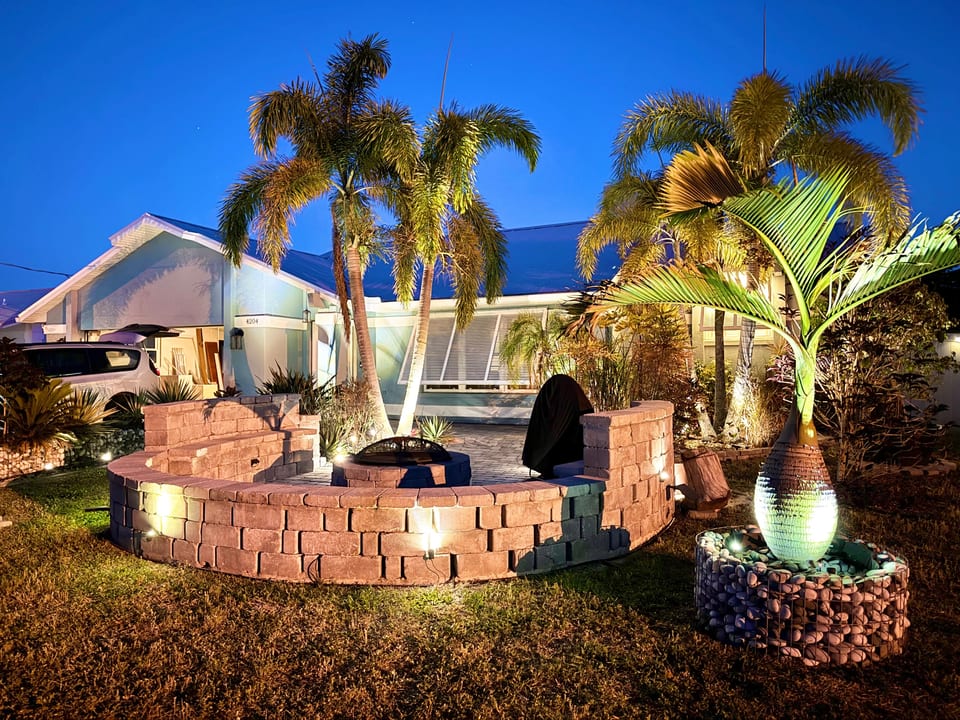 Landscape lighting and firepit in the front of the house