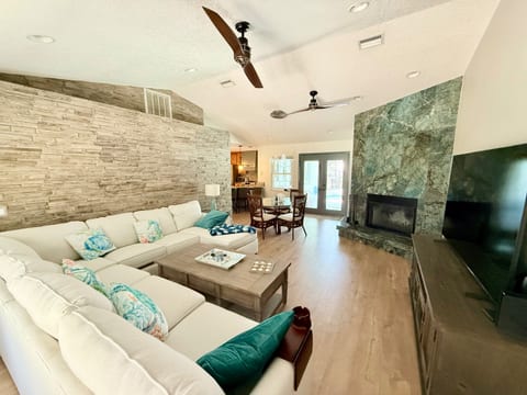 Large pull out sectional facing the fireplace and flatscreen TV