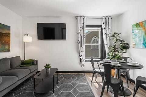 A living room that feels just like home – only better! Designed for extended stays, it's where stories are shared and memories are made. Your long-term comfort starts here. #HomeAwayForLonger