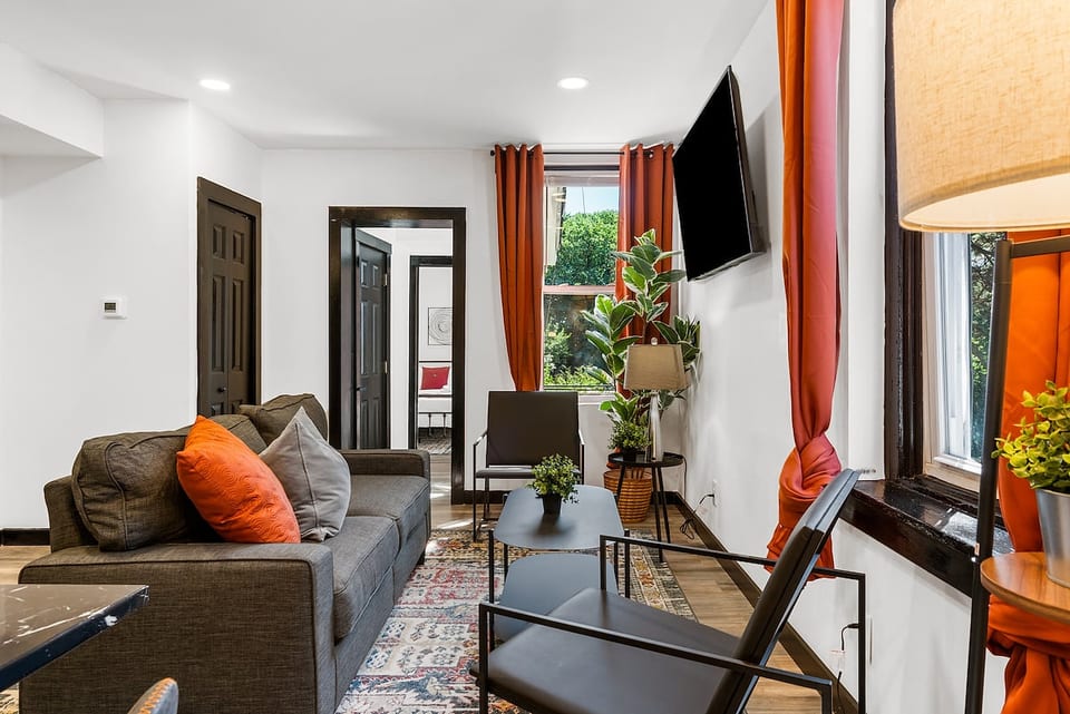 A living room that feels just like home – only better! Designed for extended stays, it's where stories are shared and memories are made. Your long-term comfort starts here. #HomeAwayForLonger