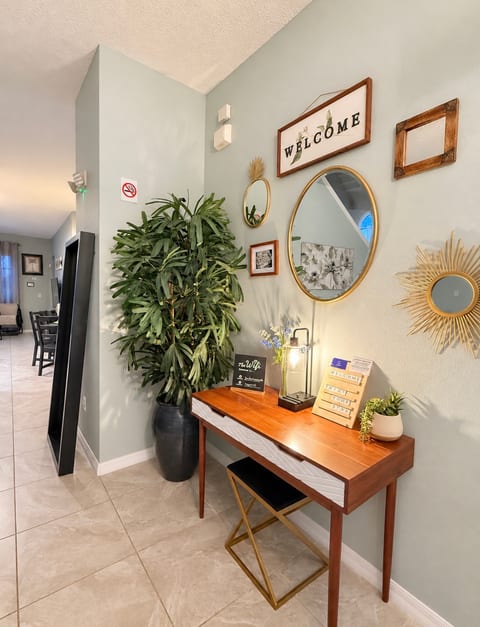 UPDTED PHOTO: Formal living area at the entrance to the home with stylish seating - a great spot for reading, relaxing and chatting