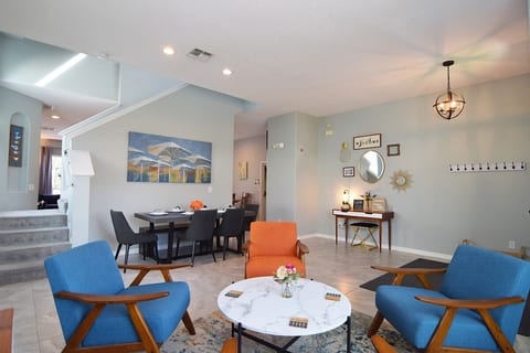 Formal living area at the entrance to the home with stylish seating - a great spot for reading, relaxing and chatting