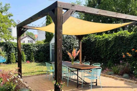 Shared backyard patio located off the back porch.