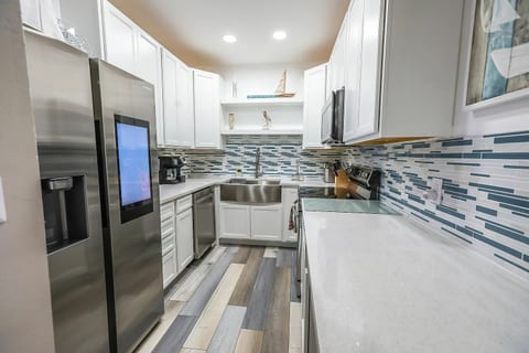 Modern kitchen with clean lines and coastal-inspired finishes.