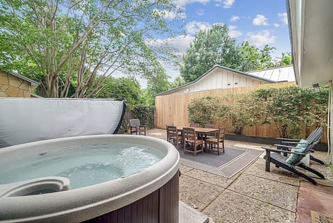 Spacious backyard with wine barrel hot tub and plenty of seating