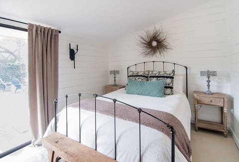 Comfy queen bed ready for you after a day of wine tasting!