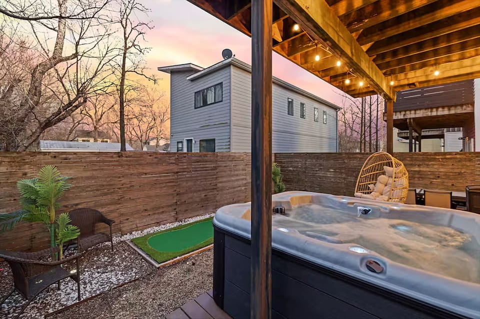 Cozy hot tub under sunset skies — your perfect unwind after a day in Fayetteville.  