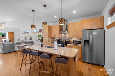 Spacious open‑concept kitchen and living area — perfect for cooking, gathering, and game days. Stainless appliances, a large island, and comfy seating make this the heart of the home.