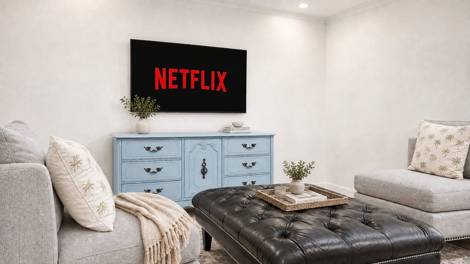 Cozy living room with Netflix, plush seating, and stylish vintage charm