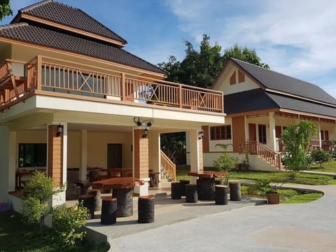 Private club house with seating, kitchen and rec room w/ ping-pong