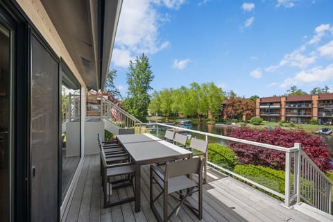 Waterfront deck with outdoor dining and peaceful scenic views