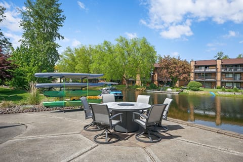 Scenic waterfront patio with outdoor seating and easy kayak access