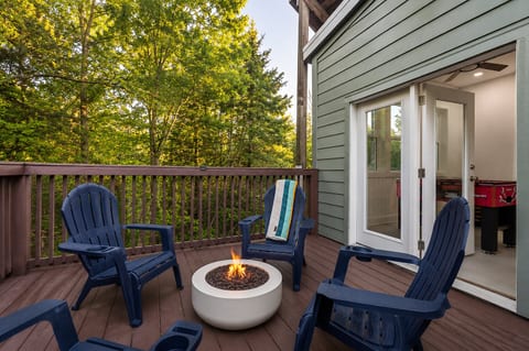 Private wooded deck with fire pit and game room access