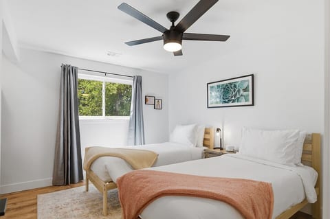 Two twin XL beds, blackout curtains, and sound machine for restful sleep
