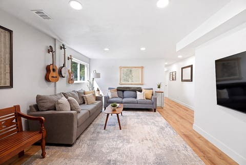 Bright, open living space with plenty of room to relax. 65 inch smart TV