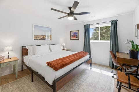Comfortable king bedroom with blackout curtains for a peaceful, restful stay