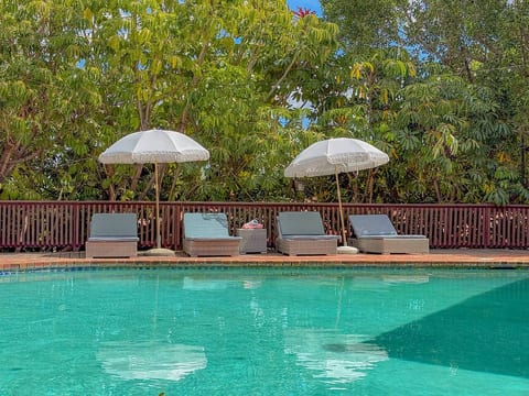 Relax by the oval-shaped saltwater pool, 6ft deep at its deepest point, ideal for both kids and adults. Features four cushioned chaise lounges, sun umbrellas, SPF, and plenty of pool toys like floats and noodles for a fun and safe experience.