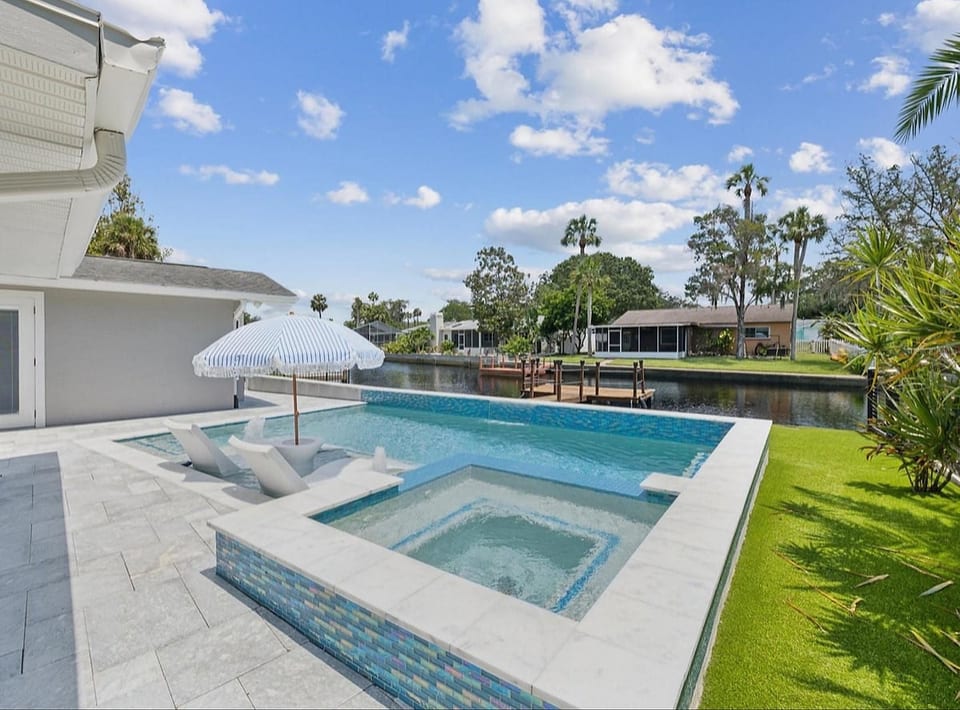 Waterfront Home w/ Heated Salt Water Pool & Spa image 1