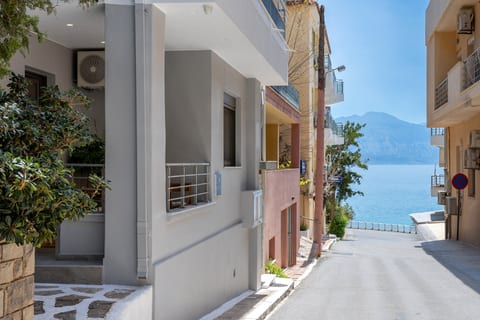 Peaceful coastal street with waterfront and mountain views nearby