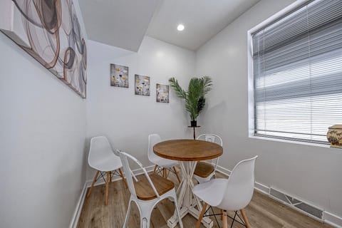 Bright modern dining nook with natural light and stylish seating