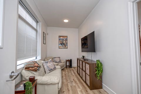 Bright, cozy TV lounge with comfy seating and natural light