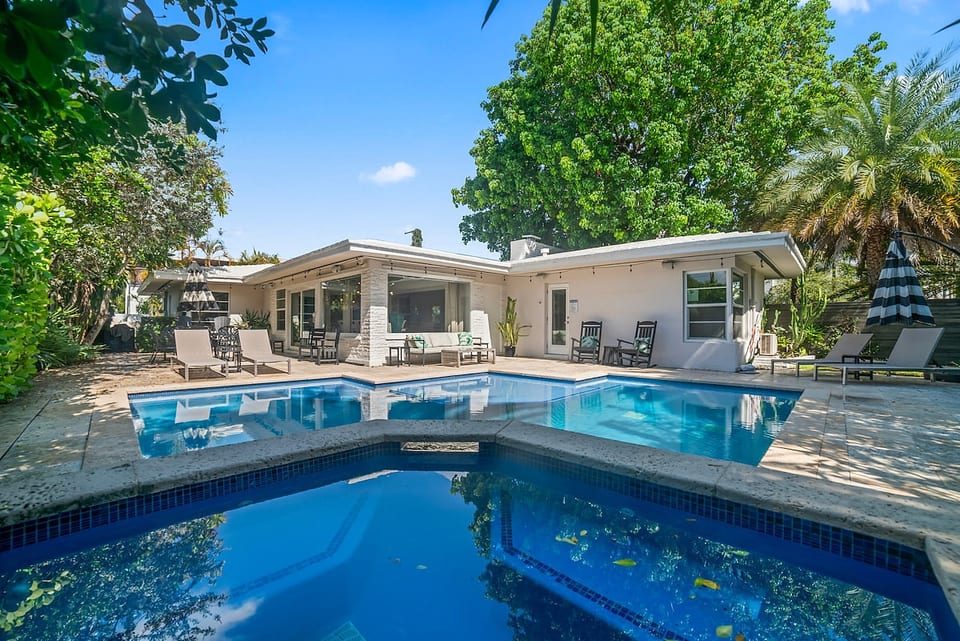 Resort-style outdoor living – Spacious patio and pool deck for lounging and entertaining.
