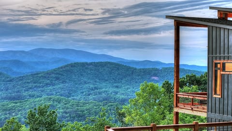 Layer upon layer of Blue Ridge mountain ridges seen from the cabin deck, stretching to the horizon