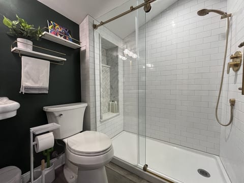 Bath with walk-in shower.
