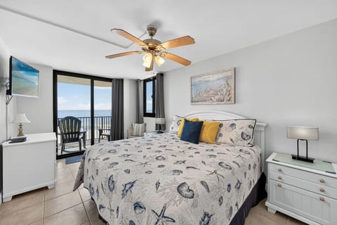 Spacious primary bedroom featuring a king bed, Smart TV, and ensuite bath access.