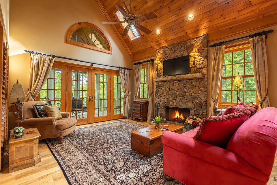 Gather around the cozy wood-burning fireplace beneath soaring vaulted ceilings and enjoy the peaceful mountain atmosphere at Cheoah Cottage.