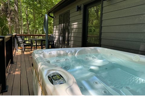 Hot tub with outdoor table and chairs