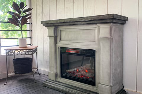 Fireplace in the screened in dining area 