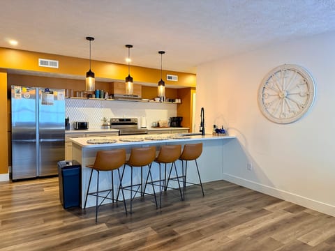Fully stocked kitchen and breakfast bar