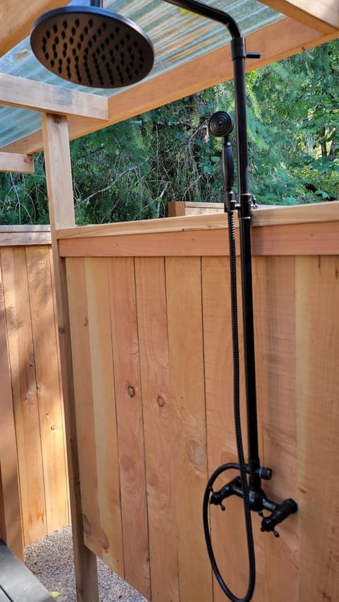 Our covered outdoor shower with unlimited hot water is just what you need to feel invigorated and ready for the outdoors. The outdoor shower is only available during warmer months to prevent freezing water pipes and damages.Private whole house cozy cottag