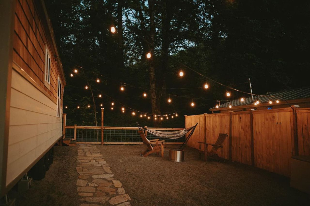Cozy private smokeless fire pit for roasting marshmallows or having a casual conversation. The lights come on automatically at dusk, lighting the way for your late arrival if needed. Private whole house cozy cottage on relaxing burbling creek. Gateway to